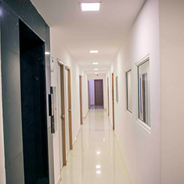 Lift entrance, clinic corridor, accessible design, patient mobility support